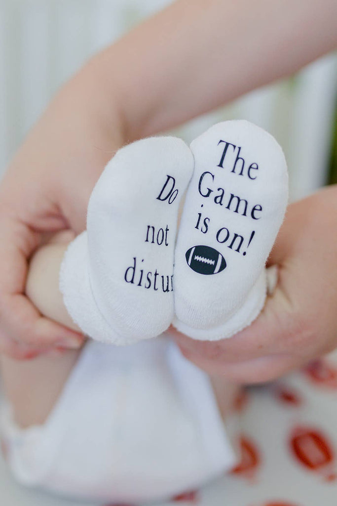Do Not Disturb The Game is on Football Baby Socks | Sports: 0-6mo